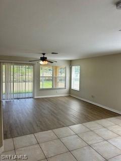 18301 Pine Nut Ct, Lehigh Acres, FL 33972 - spare room featuring a ceiling fan, tile patterned floors, and baseboards