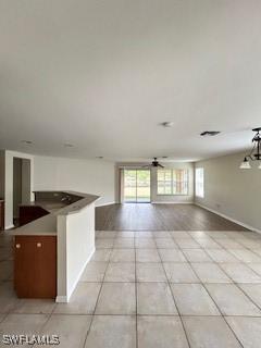 18301 Pine Nut Ct, Lehigh Acres, FL 33972 - interior space featuring baseboards, a ceiling fan, and light tile patterned flooring