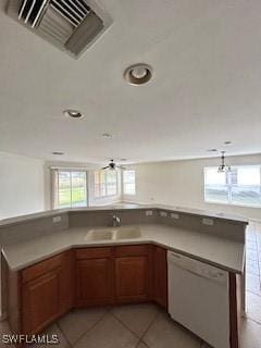 18301 Pine Nut Ct, Lehigh Acres, FL 33972 - kitchen with visible vents, brown cabinets, dishwasher, a sink, and light tile patterned floors