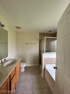 18301 Pine Nut Ct, Lehigh Acres, FL 33972 - full bathroom featuring tile patterned flooring, a garden tub, double vanity, a shower stall, and a sink