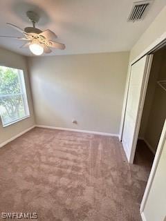 18301 Pine Nut Ct, Lehigh Acres, FL 33972 - unfurnished bedroom featuring visible vents, carpet flooring, baseboards, and a closet