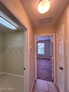 18301 Pine Nut Ct, Lehigh Acres, FL 33972 - corridor with visible vents and baseboards
