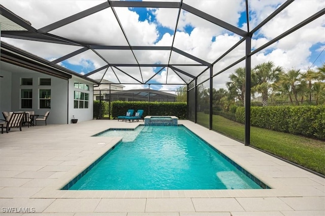 view of pool featuring glass enclosure, a patio area, and a pool with connected hot tub