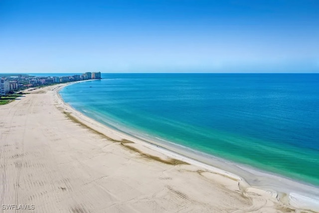 140 Seaview Ct Unit 103N, Marco Island, FL 34145 - property view of water featuring a beach view