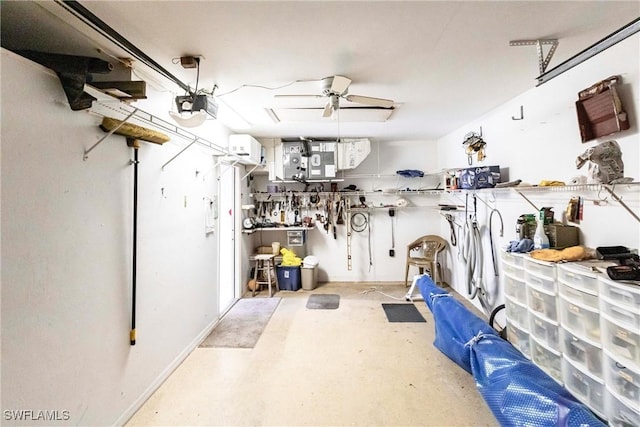 garage featuring a garage door opener and a workshop area