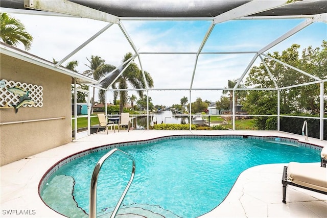 pool with a lanai and a patio