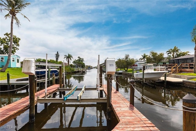 view of dock featuring a water view and boat lift