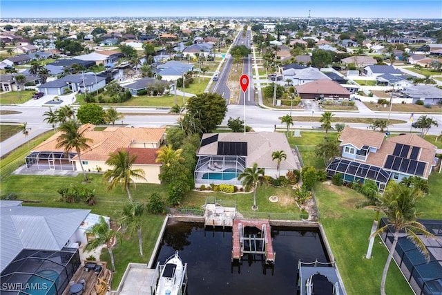 birds eye view of property featuring a residential view and a water view