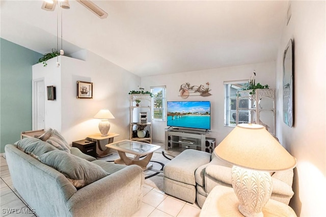 tiled living area featuring vaulted ceiling and ceiling fan