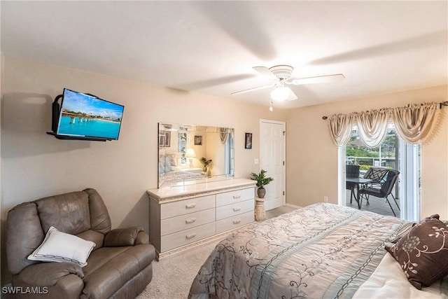bedroom with carpet floors, access to exterior, and a ceiling fan