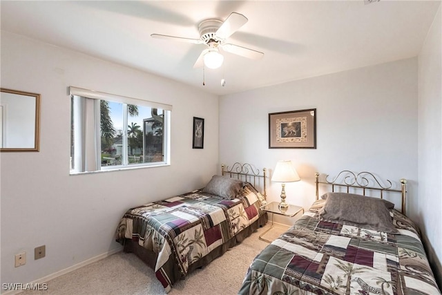 bedroom with light carpet and a ceiling fan