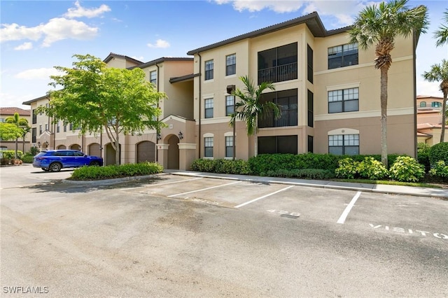 view of property with uncovered parking