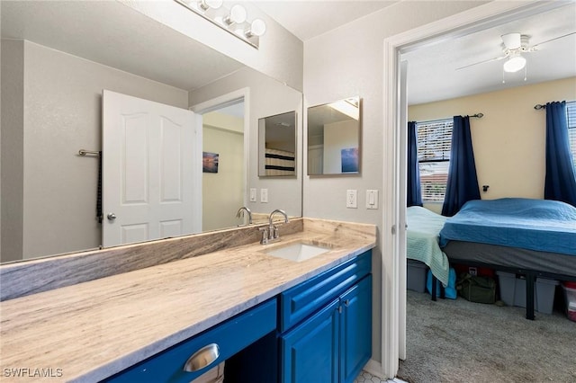 bathroom with ceiling fan and vanity