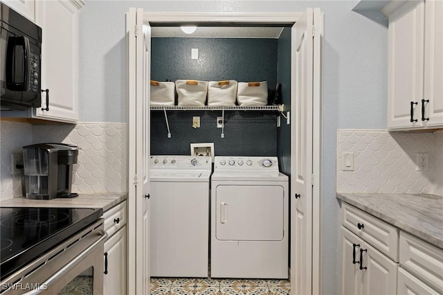clothes washing area featuring washing machine and clothes dryer