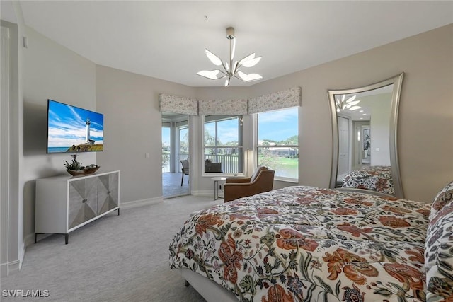 bedroom with carpet floors, baseboards, a chandelier, and access to exterior