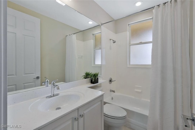 bathroom with vanity, recessed lighting, shower / bath combination with curtain, and toilet