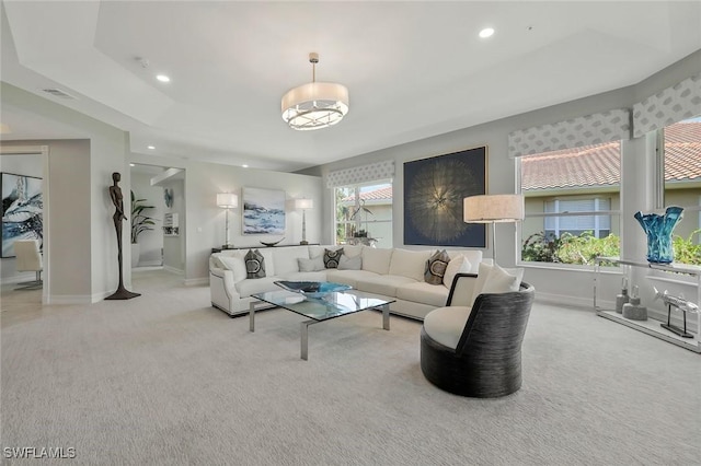 carpeted living room featuring baseboards, recessed lighting, and visible vents