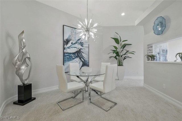 dining room with carpet flooring, baseboards, and a notable chandelier
