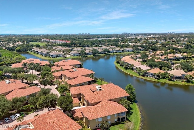 birds eye view of property featuring a water view and a residential view