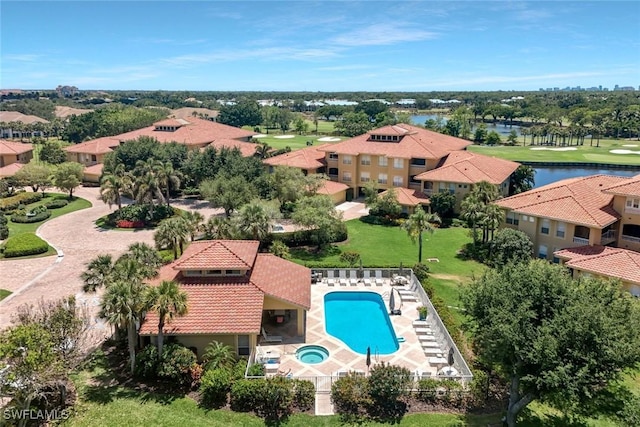 birds eye view of property featuring a water view and golf course view