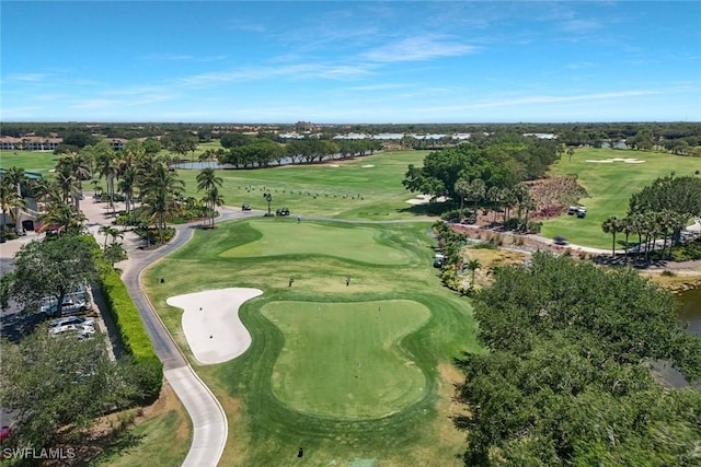 drone / aerial view featuring a water view and golf course view