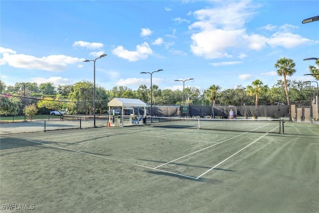 view of sport court featuring fence