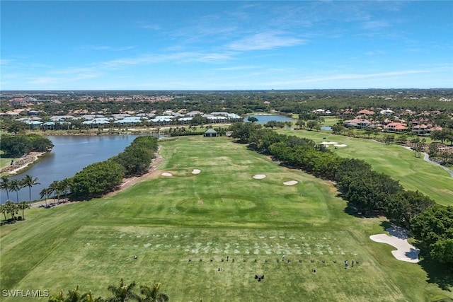 birds eye view of property with a water view, view of golf course, and a residential view
