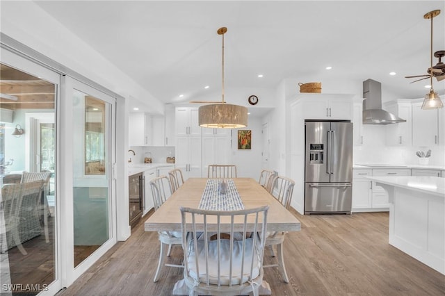 dining room with light wood-style flooring, recessed lighting, and a ceiling fan