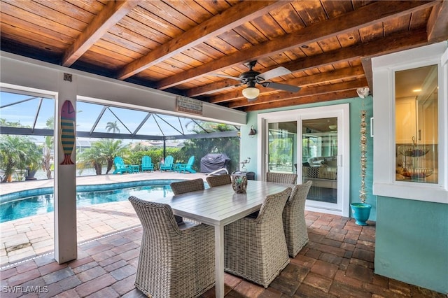 view of patio featuring a lanai, an outdoor pool, ceiling fan, and outdoor dining area