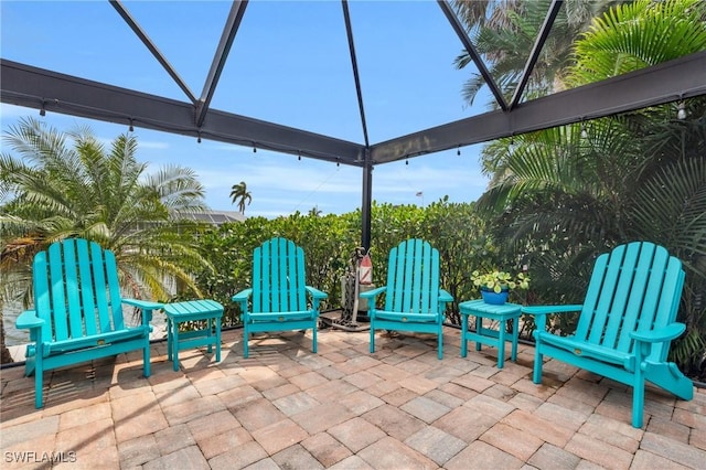 view of patio with a lanai
