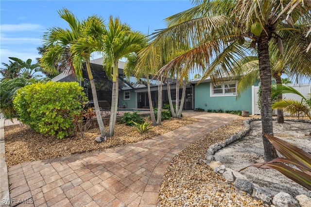 view of front of house featuring a lanai and stucco siding
