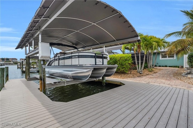 view of dock featuring a water view and boat lift