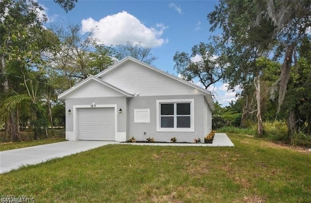 4637 Elvas Ave S, Fort Myers, FL 33905 - single story home with concrete driveway, an attached garage, a front yard, and stucco siding