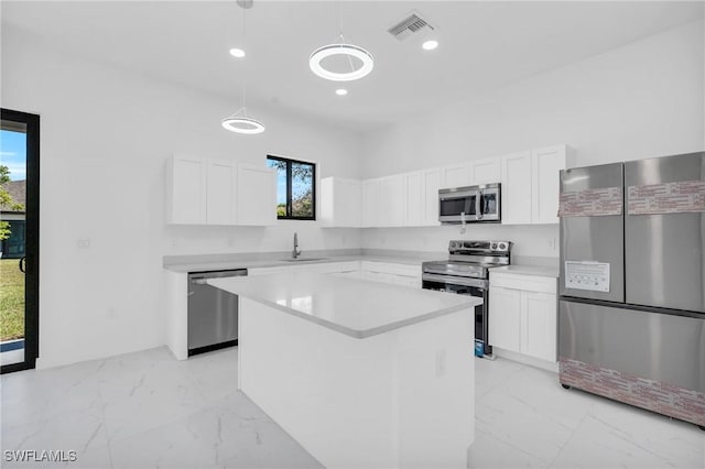 3101 NW 42nd Pl, Cape Coral, FL 33993 - kitchen featuring stainless steel appliances, light marble finish flooring, healthy amount of natural light, hanging light fixtures, and recessed lighting