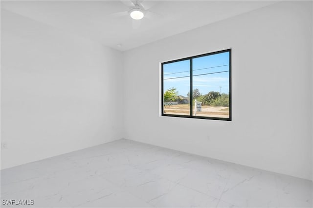 3101 NW 42nd Pl, Cape Coral, FL 33993 - unfurnished room featuring marble look tiles and ceiling fan