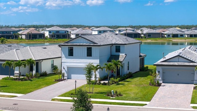 20250 Napa Loop, Estero, FL 33928 - view of front of house featuring a front yard, a residential view, a water view, and decorative driveway