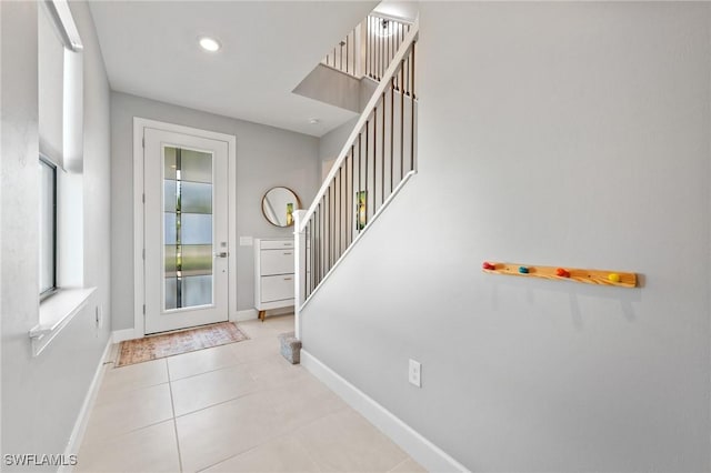 20250 Napa Loop, Estero, FL 33928 - foyer entrance with recessed lighting, baseboards, tile patterned flooring, and stairs
