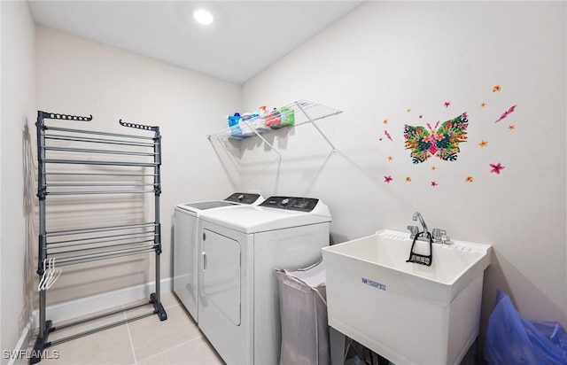 20250 Napa Loop, Estero, FL 33928 - clothes washing area featuring a sink, light tile patterned flooring, radiator, independent washer and dryer, and laundry area