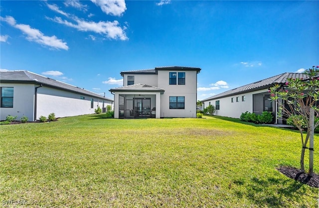 20250 Napa Loop, Estero, FL 33928 - back of property with a yard and a sunroom