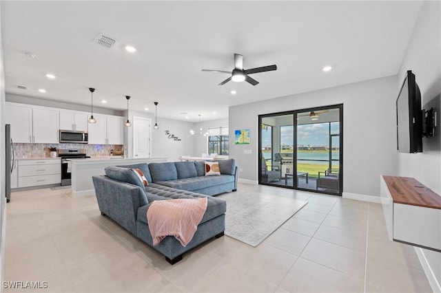 20250 Napa Loop, Estero, FL 33928 - living room with recessed lighting, light tile patterned flooring, visible vents, and ceiling fan