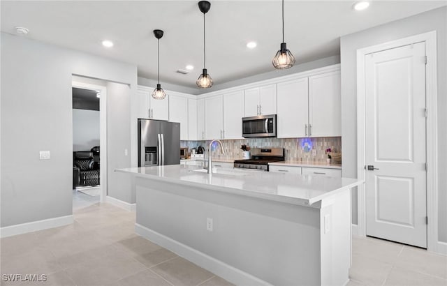 20250 Napa Loop, Estero, FL 33928 - kitchen with white cabinets, appliances with stainless steel finishes, tasteful backsplash, and a sink