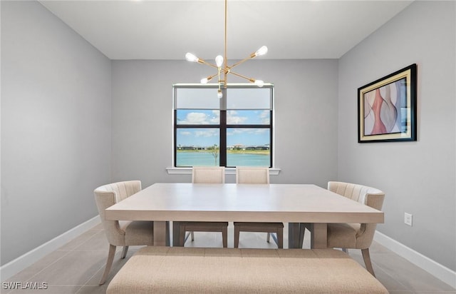 20250 Napa Loop, Estero, FL 33928 - dining room featuring light tile patterned floors, baseboards, and an inviting chandelier