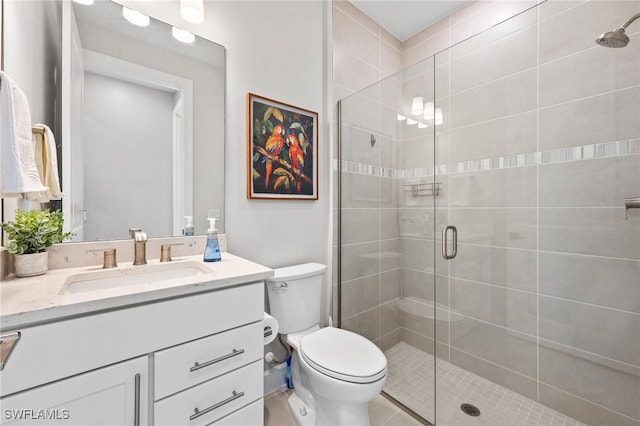 20250 Napa Loop, Estero, FL 33928 - full bathroom featuring tile patterned flooring, toilet, vanity, and a stall shower