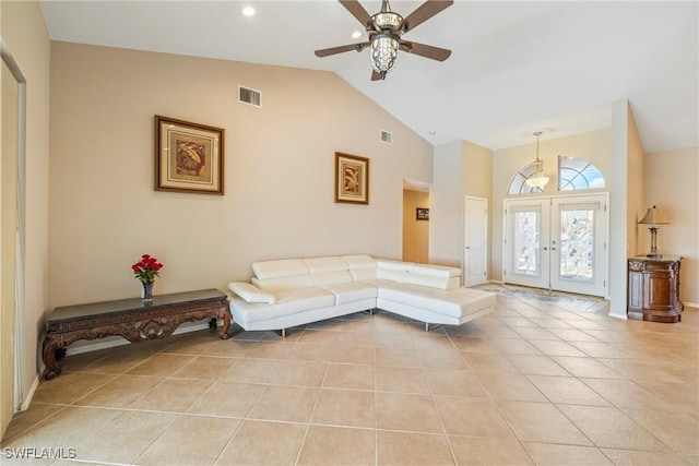 2817 La Mancha Ct, Punta Gorda, FL 33950 - living area with french doors, light tile patterned floors, a ceiling fan, and high vaulted ceiling