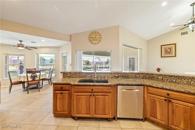 2817 La Mancha Ct, Punta Gorda, FL 33950 - kitchen featuring a ceiling fan, light tile patterned floors, brown cabinetry, recessed lighting, and vaulted ceiling