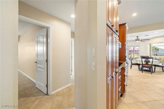 2817 La Mancha Ct, Punta Gorda, FL 33950 - corridor with light tile patterned floors, recessed lighting, and a textured wall