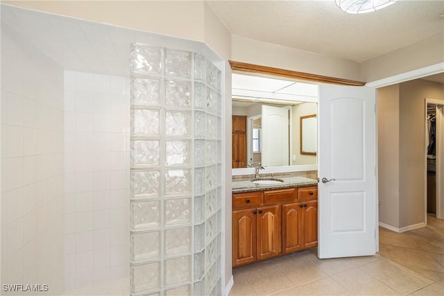 2817 La Mancha Ct, Punta Gorda, FL 33950 - bathroom with vanity, walk in shower, and tile patterned flooring