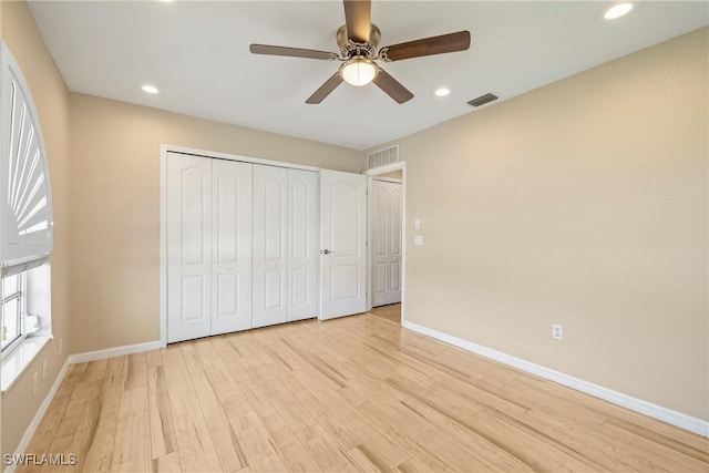 2817 La Mancha Ct, Punta Gorda, FL 33950 - unfurnished bedroom with light wood-style floors, recessed lighting, a closet, and ceiling fan