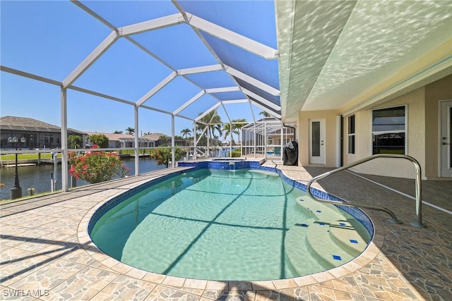 2817 La Mancha Ct, Punta Gorda, FL 33950 - view of pool with a patio area, a pool with connected hot tub, a water view, and glass enclosure
