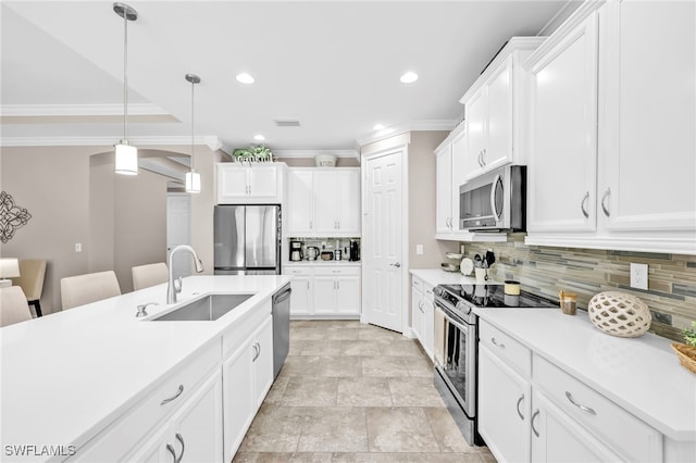 14482 Tuscany Pointe Trl, Naples, FL 34120 - kitchen with tasteful backsplash, a sink, light countertops, ornamental molding, and stainless steel appliances